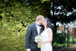 Bride and Groom share a kiss at Plum Park Hotel