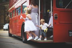 Jumping off the bus, bridesmaid, page boy, double decker, big red bus, wedding, wedding photographer, wedding photography